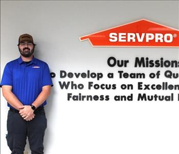 man in front of mission statement