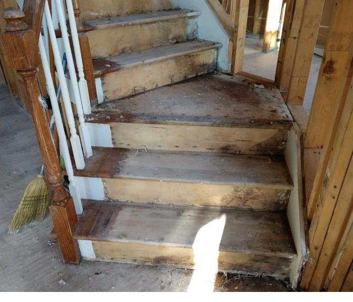 wooden staircase inside of home that caught on fire. 