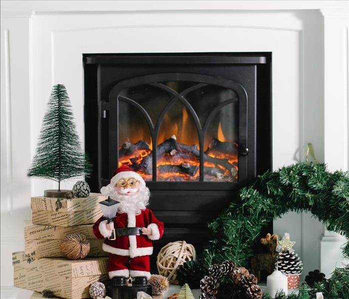 A Christmas setup surrounding a fireplace